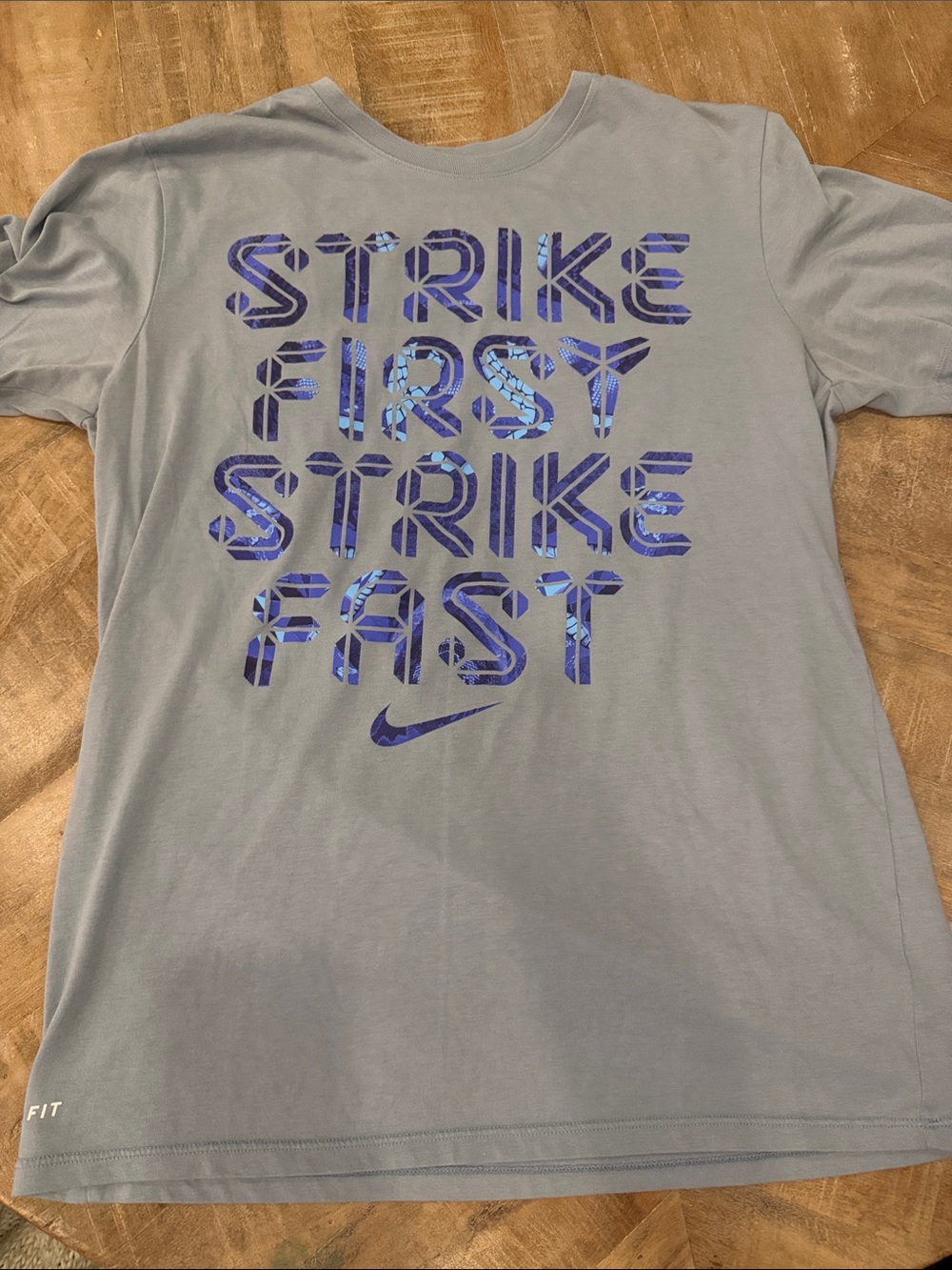 Nike Light Gray Short Sleeve Tee with Blue Graphic 'Strike First Strike Fast'